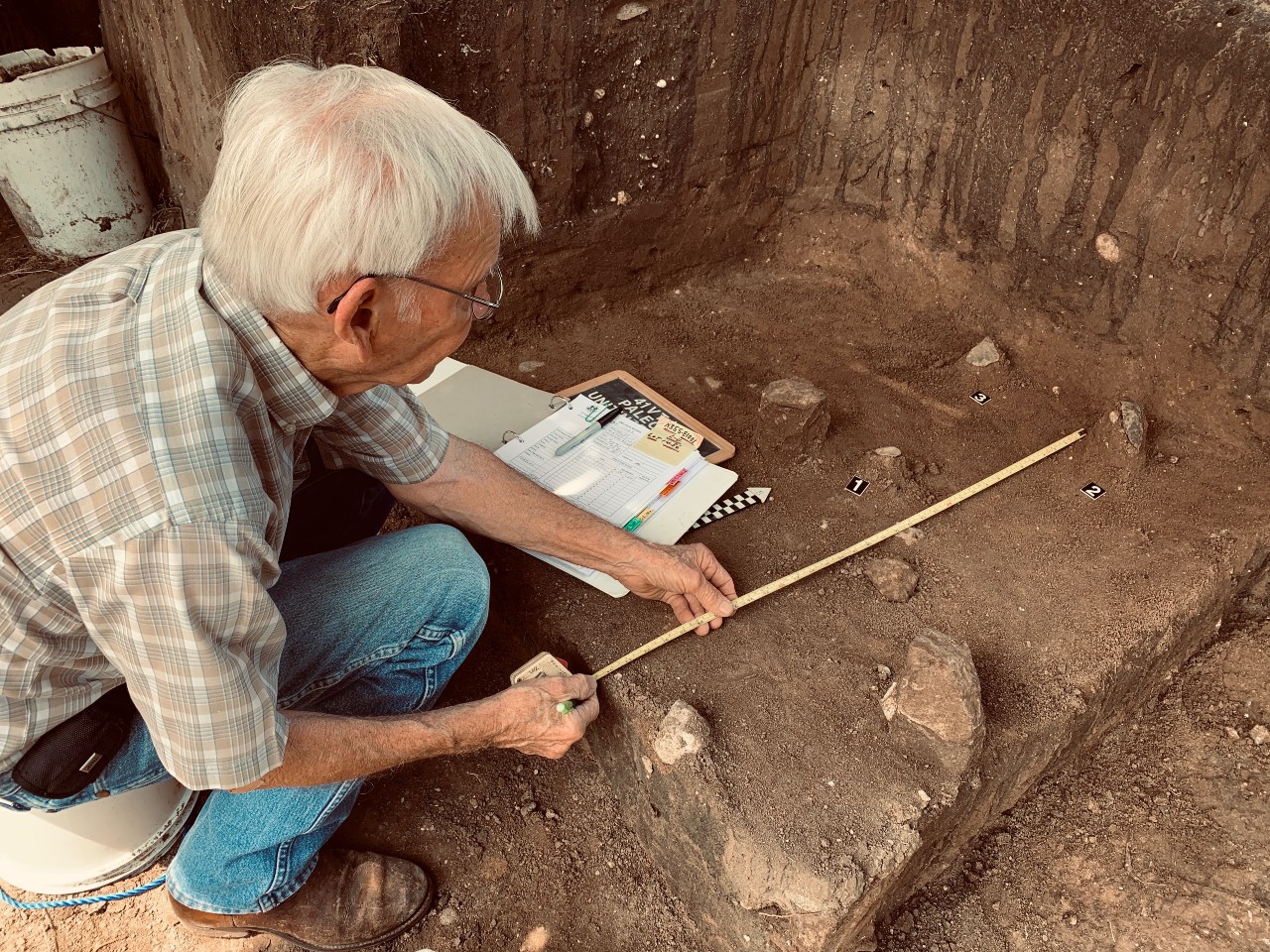 Bill Birmingham, an archaeological steward, records artifacts in situ at the McNeill Ranch Site.